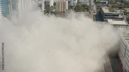 Smoke after a building implosion in Miami Beach, Florida