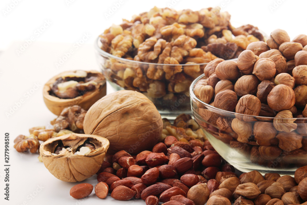 Different nuts in glass cups Different nuts in glass cups