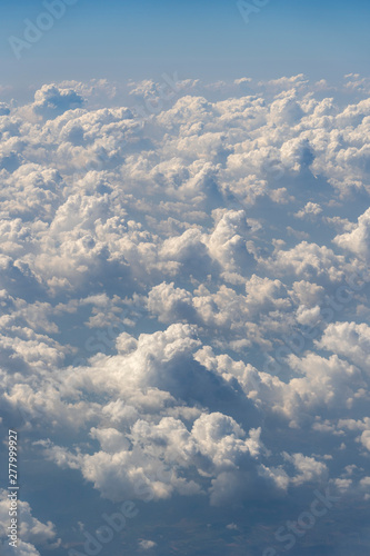 Fototapeta Naklejka Na Ścianę i Meble -  White clouds and blue sky, a view from airplane window