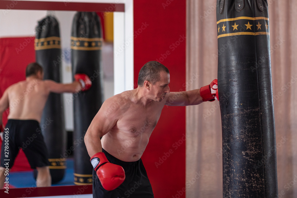 Boxer working with heavy bag