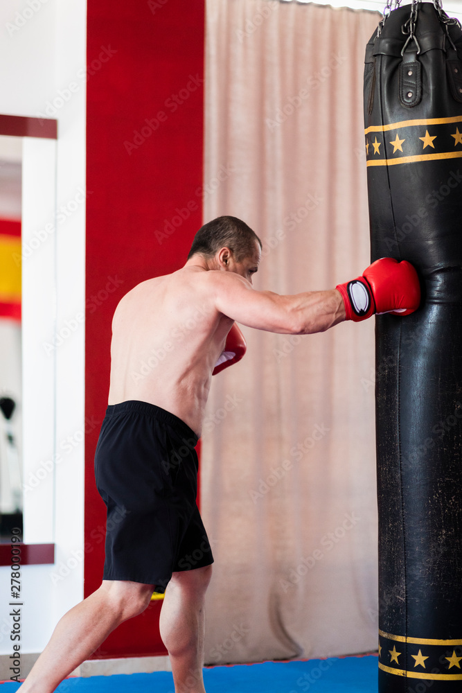Boxer working with heavy bag