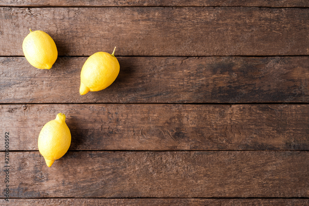 Overhead shot of lemons on wooden table