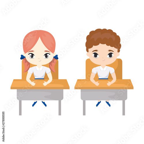 little students seated in school desks