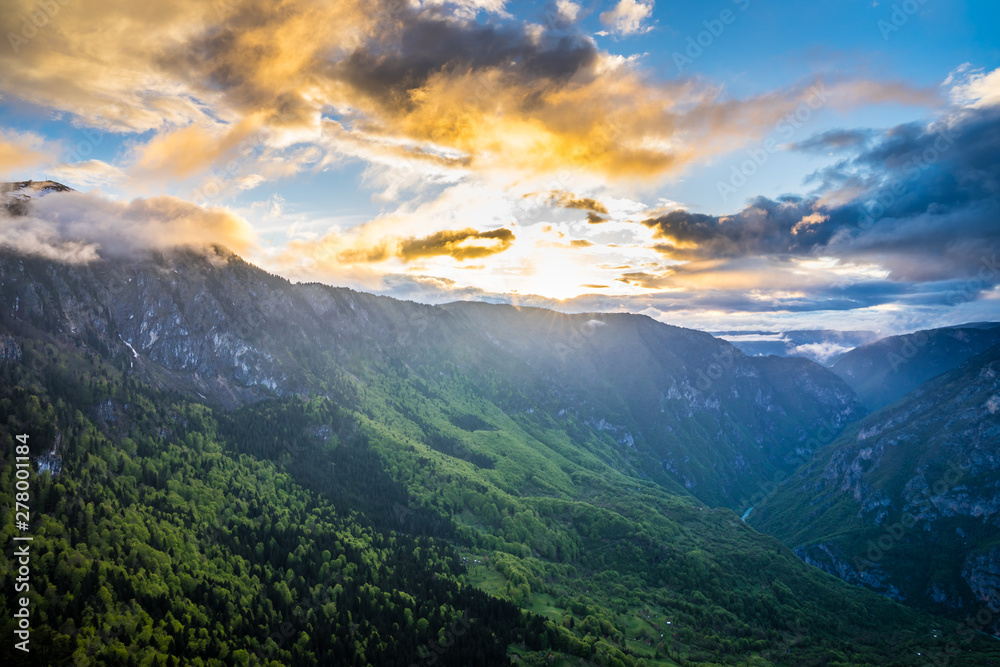 Montenegro, Beautiful colorful orange sunset sky decorating spectacular nature landscape of tara river canyon from above at dawn in durmitor national park near zabljak