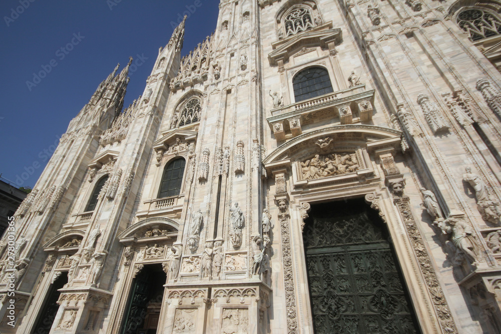 The Piazza del Duomo milano, Famous white Architectural cathedral church under blue sky at Milan, The largest church in Italy, travel destination backgrounds