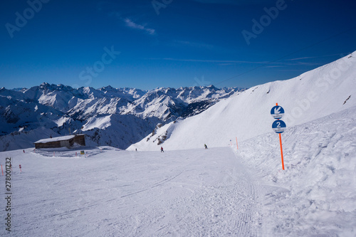bavarian alps mountain top in winter blue ski slope