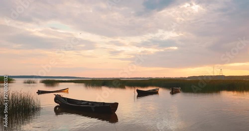 Braslaw Or Braslau, Vitebsk Voblast, Belarus. Wooden Rowing Fishing Boats In Beautiful Summer Sunset On The Dryvyaty Lake. This Is The Largest Lake Of Braslav Lakes. Typical Nature Of Belarus photo