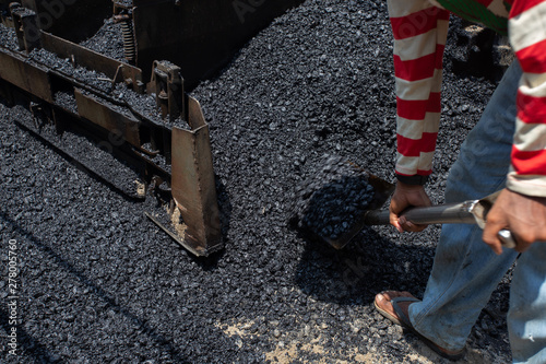 Construction work for a road and highway repair,Concept: Transportation symbol for vehicle safety,Worker operating asphalt road city