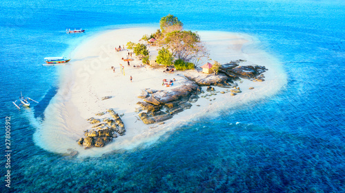 Gili Kedis island with white sand and tourist photo