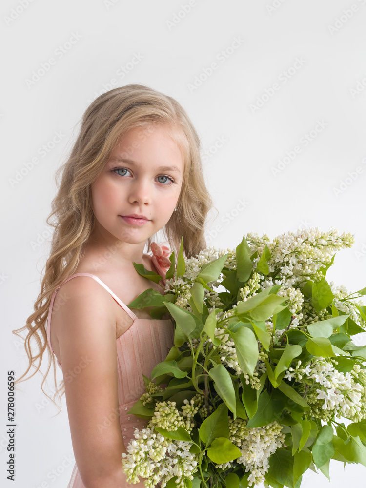 Beautiful girl with a bouquet of lilac closeup Beautiful girl with a bouquet of lilac closeup