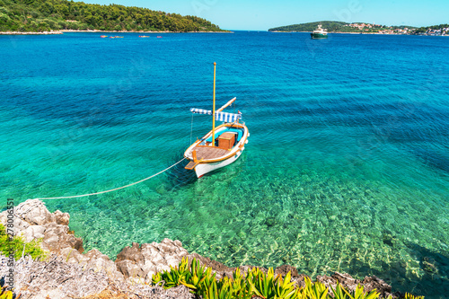 Boat moored to a rocky shore, Adriatic sea, Croatia