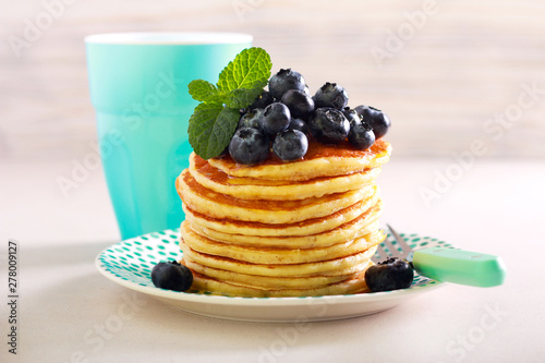 Pancakes with blueberry on top, served