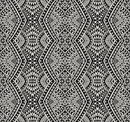 Fototapeta Vector abstract seamless pattern from black, grey and light beige ikat geometrical shapes, rhombus, triangles, Maori ornaments, waves, stripes