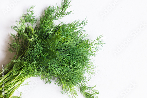 Dill greens on natural clay ceramic background. Vegan food. The concept of healthy eating.