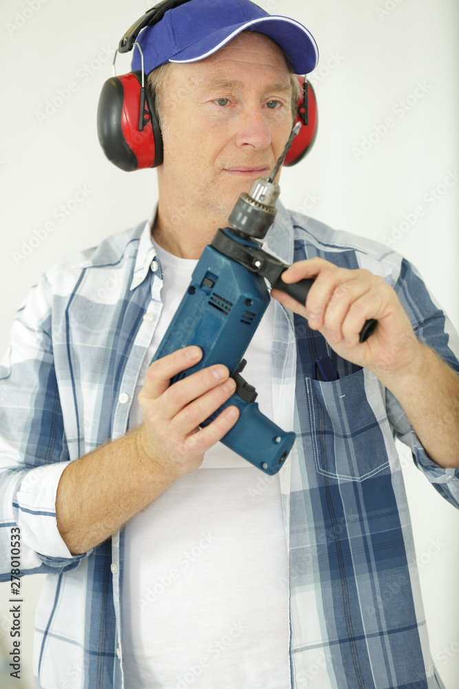 young man of mature carpenter in the workshop young man of mature carpenter in the workshop