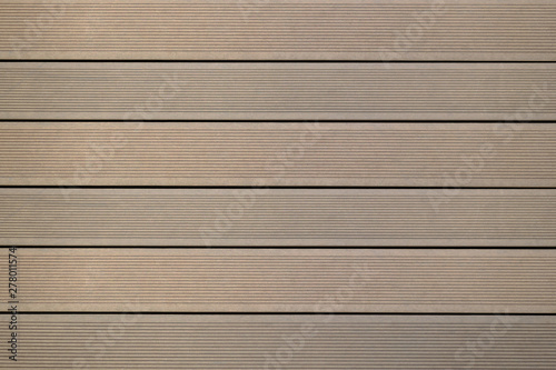 Top view of WPC in oak color. WPC: Wood-Plastic Composites are wood fiber and thermoplastic such as PE, PP, PVC, or PLA. A WPC decking are stylish and enrich the outdoor living