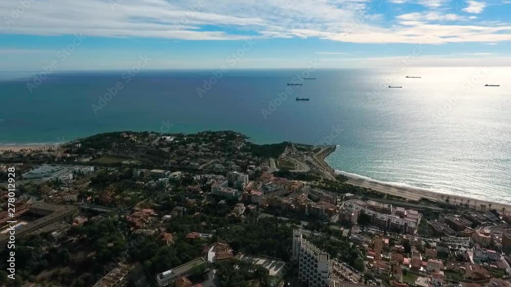 Panoramic aerial view of the coastline and ships on the roadstead of Tarragona, Spain Panoramic aerial view of the coastline and ships on the roadstead of Tarragona, Spain