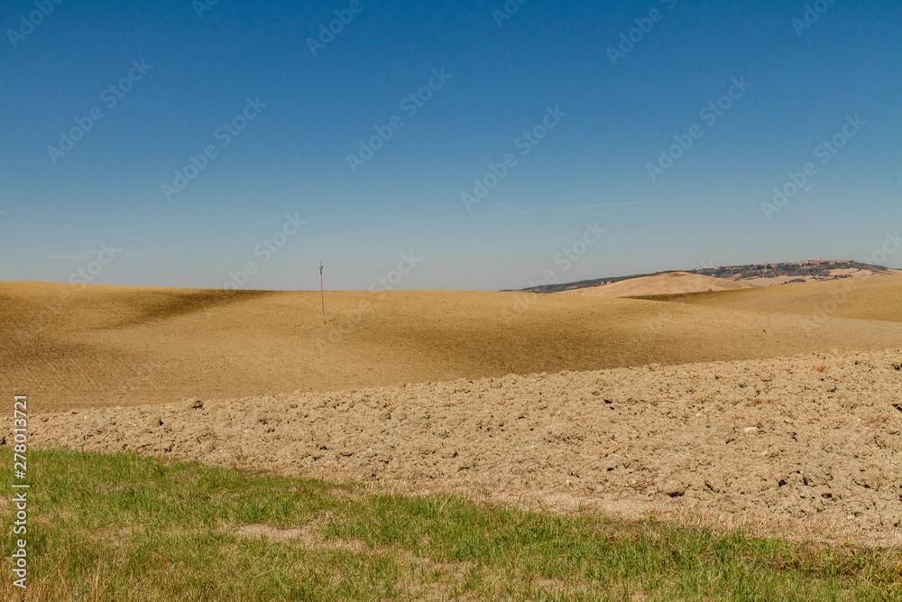 panorama of Tuscan countryside with blue sky Italy