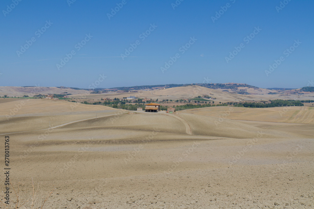 panorama of Tuscan countryside with blue sky Italy