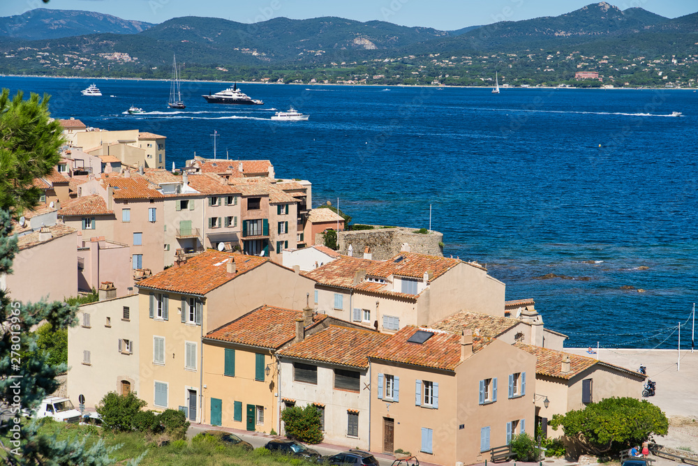 Panorama of Saint-Tropez, the roofs of houses, the chapel of St. Anne, the yacht in the bay. Commune in southeastern France in the region of Provence, Alpes - Cote d'Azur, France