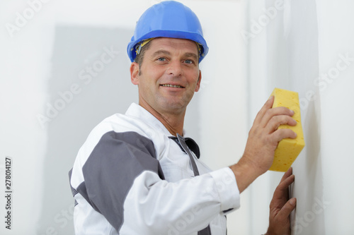 portait of a whitewasher man at work