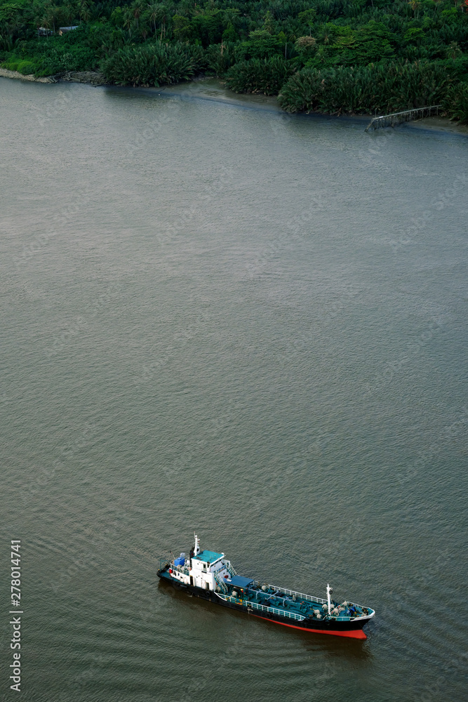 aerial view; motor boat cruised along chaophraya river near bangkrachao sub-district, bangkok, thailand