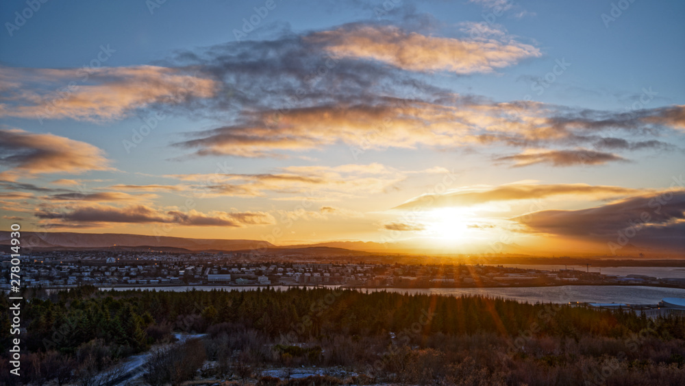 Beautiful sunset over East Reykjavik city in winter with view from top of perlan tower