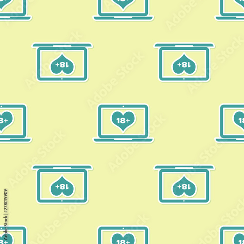 Green Laptop computer with 18 plus content heart icon isolated seamless pattern on yellow background. Age restriction symbol. 18 plus content sign. Adult channel. Vector Illustration