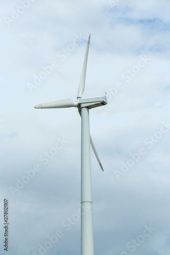 Wind turbine against the sky. Creating clean electricity.
