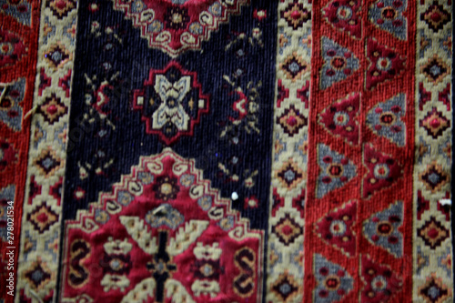 Part borders vintage silky thin carpet with ethnic pattern