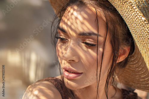 Portrait of beauty girl in summer hat.