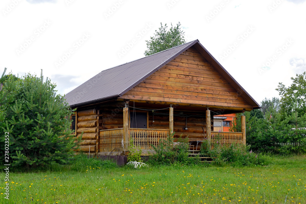 Fototapeta premium Typical Russian cottage, dacha in Russian.
