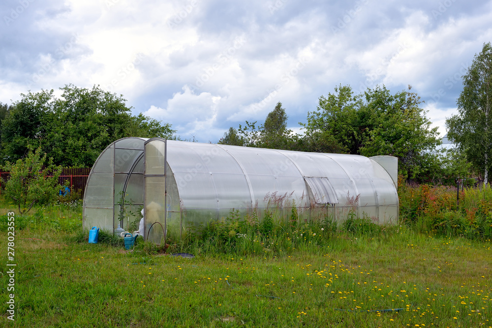 Greenhouse made of metal frame and plastic exterior Greenhouse made of metal frame and plastic exterior