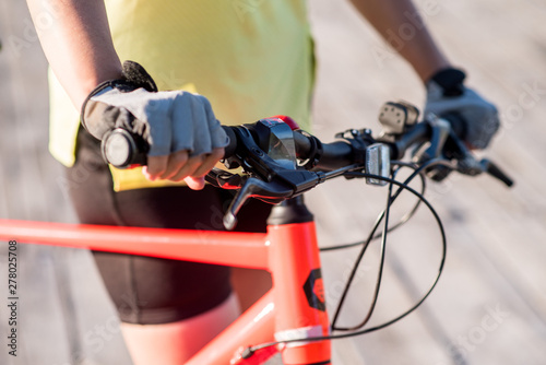 Close up womans hands on bike photo