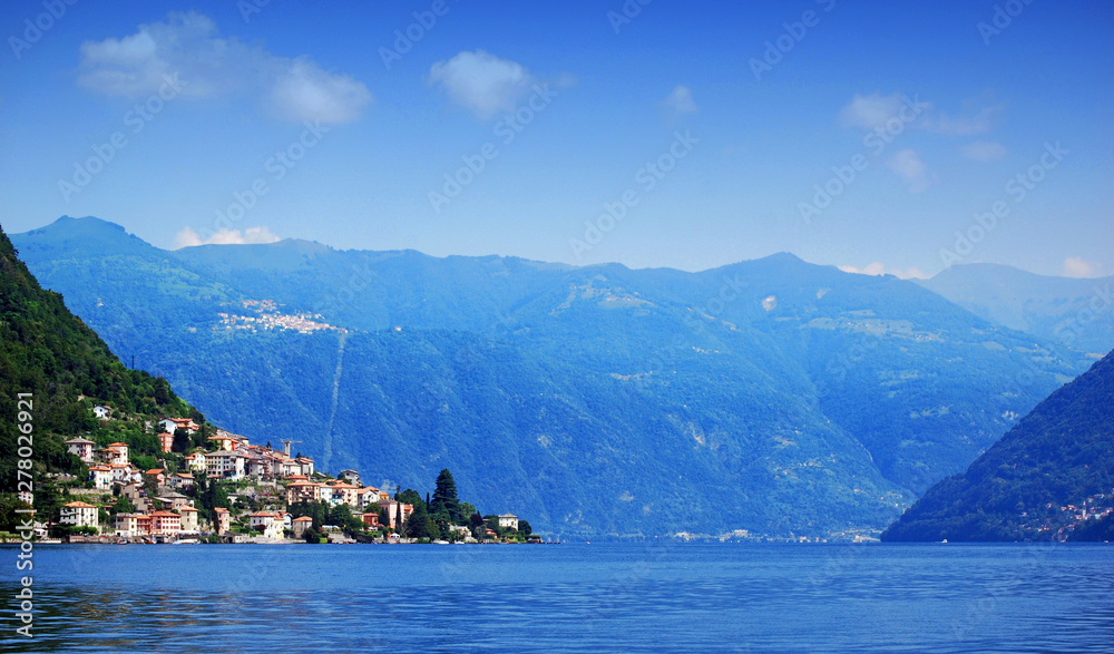 Sailing on Lake Como, panorama view. Lombardy, Italy 