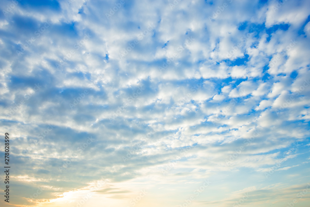 Fototapeta premium blue sky background texture with white clouds sunset.
