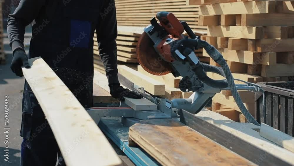 Close up of wood cutting machine cuts plank. Close up of wood cutting machine cuts plank.