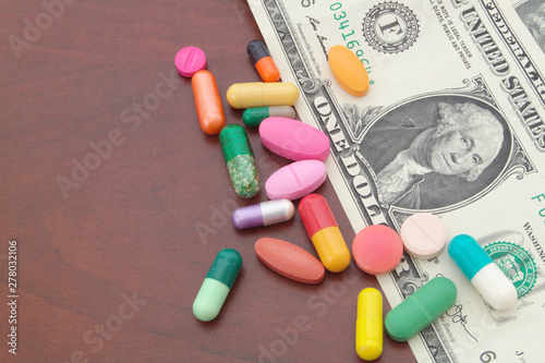 Drugs and dollars on table with room for text