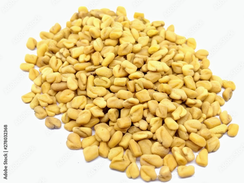 A picture of fenugreek isolated on a white background A picture of fenugreek isolated on a white background