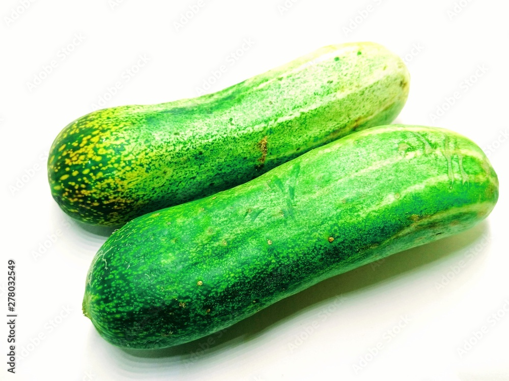 A picture of fresh cucumbers isolated on white background A picture of fresh cucumbers isolated on white background