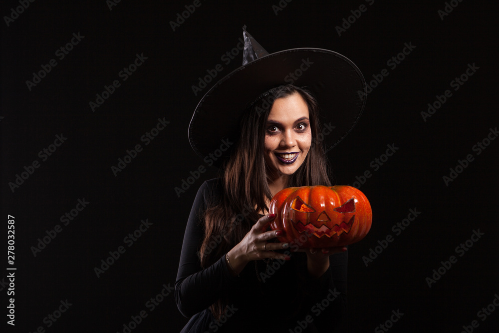 Young beautiful woman dressed up like a witch for halloween Young beautiful woman dressed up like a witch for halloween