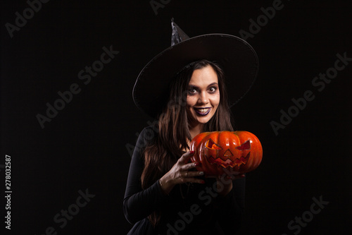 Young beautiful woman dressed up like a witch for halloween
