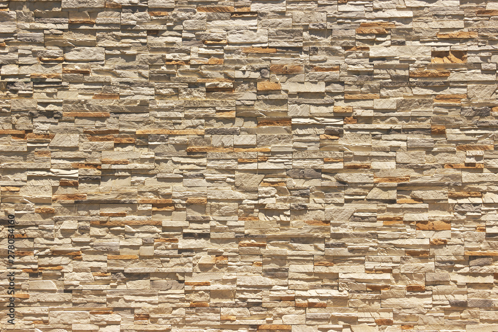 Fototapeta premium Brick wall of decorative slate stone, colorful horizontal architecture.