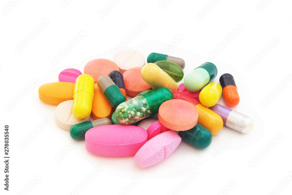 Medication and healthcare concept. Heap of colorful pills and drugs isolated on white background Medication and healthcare concept. Heap of colorful pills and drugs isolated on white background