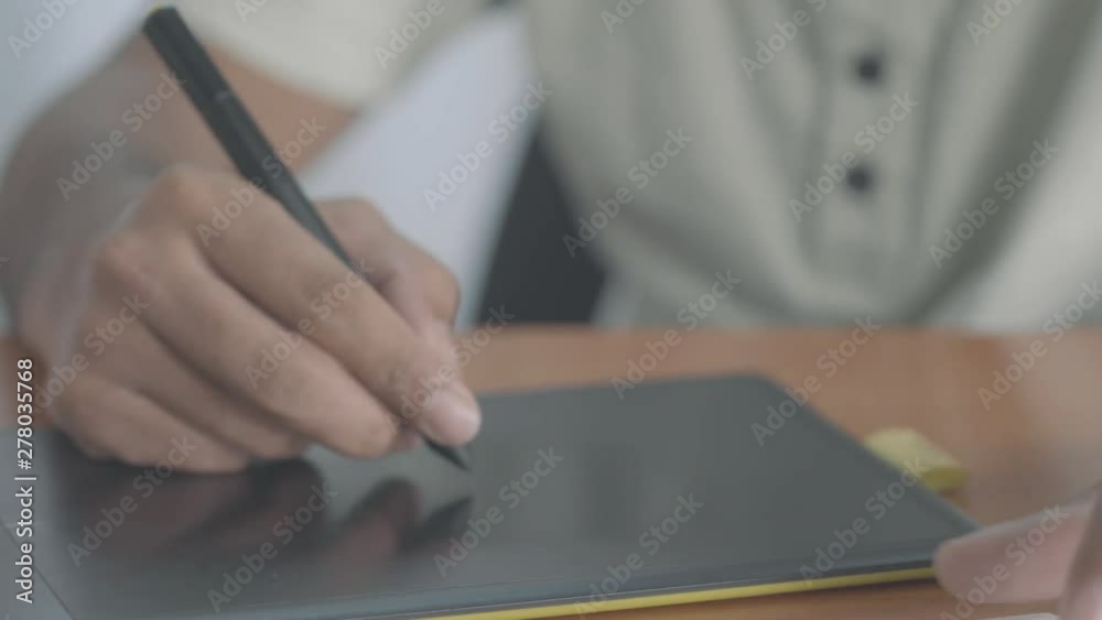 Designer / Artist Working With A Graphic Tablet Designer / Artist Working With A Graphic Tablet