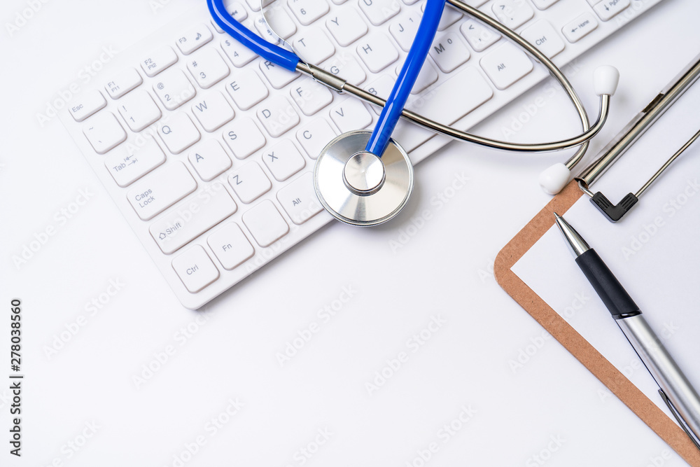 Medical Concept - Stethoscope on computer keyboard on white background. Physician long term care treatment concept. Top view, flat lay, copy space Medical Concept - Stethoscope on computer keyboard on white background. Physician long term care treatment concept. Top view, flat lay, copy space