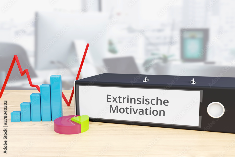 Extrinsische Motivation – Finanzen/Wirtschaft. Ordner auf Schreibtisch mit Beschriftung neben Diagrammen. Business/Statistik - obrazy, fototapety, plakaty 
