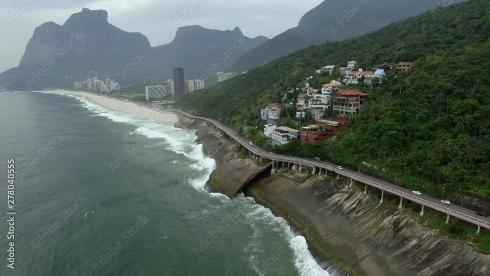 Highway by the sea. Wonderful road and bike path. Bicycle and road track and next to the blue sea in the city of Rio de Janeiro. Tim Maia bike path on Niemeyer Avenue, Rio de Janeiro, Brazil. Highway by the sea. Wonderful road and bike path. Bicycle and road track and next to the blue sea in the city of Rio de Janeiro. Tim Maia bike path on Niemeyer Avenue, Rio de Janeiro, Brazil.