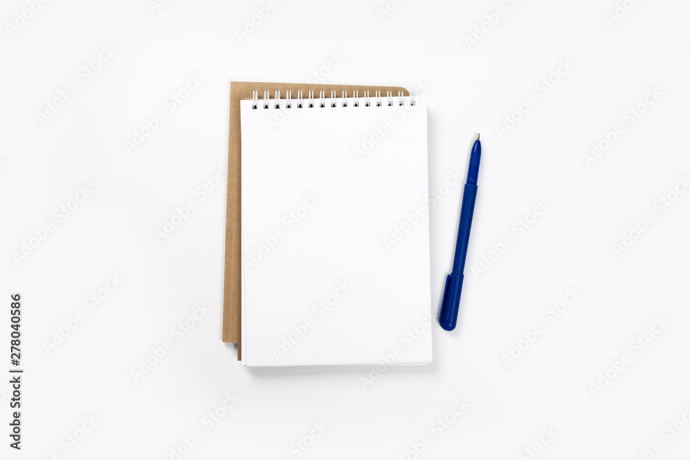 school notebook on a white background, spiral notepad on a table. school notebook on a white background, spiral notepad on a table.
