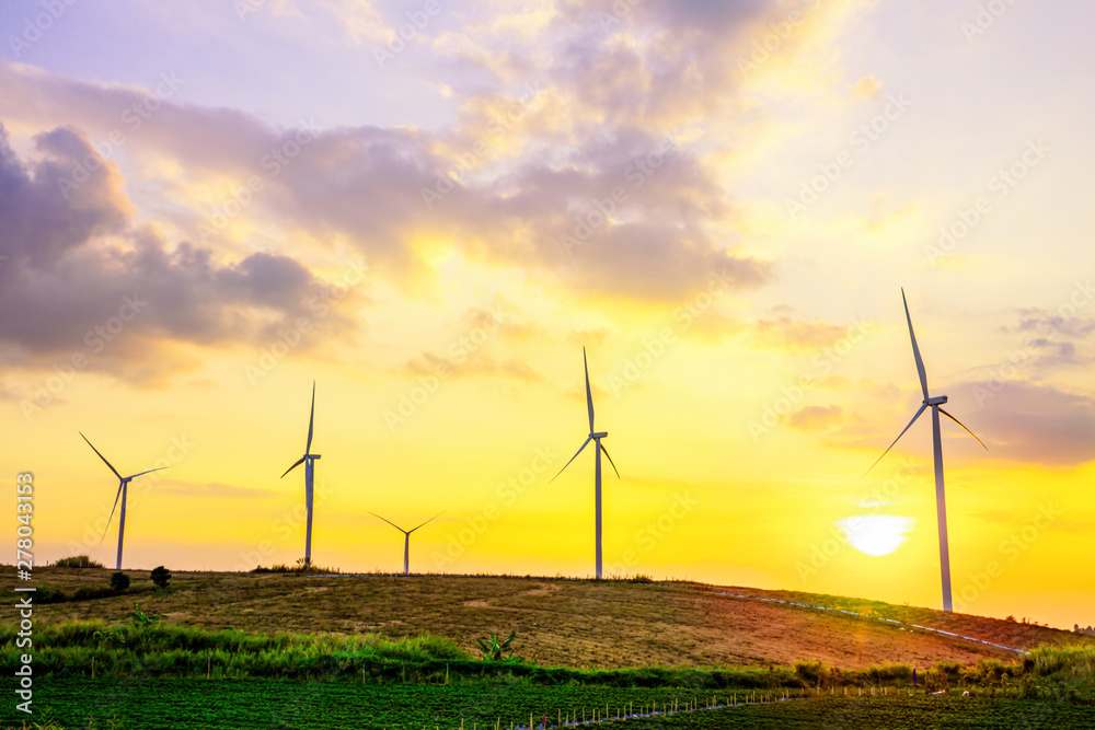 Obraz premium Landscape mountain view with windmills on the hill with sunset sky, Wind turbine generator to build electricity power in rural area, Electricity power concept